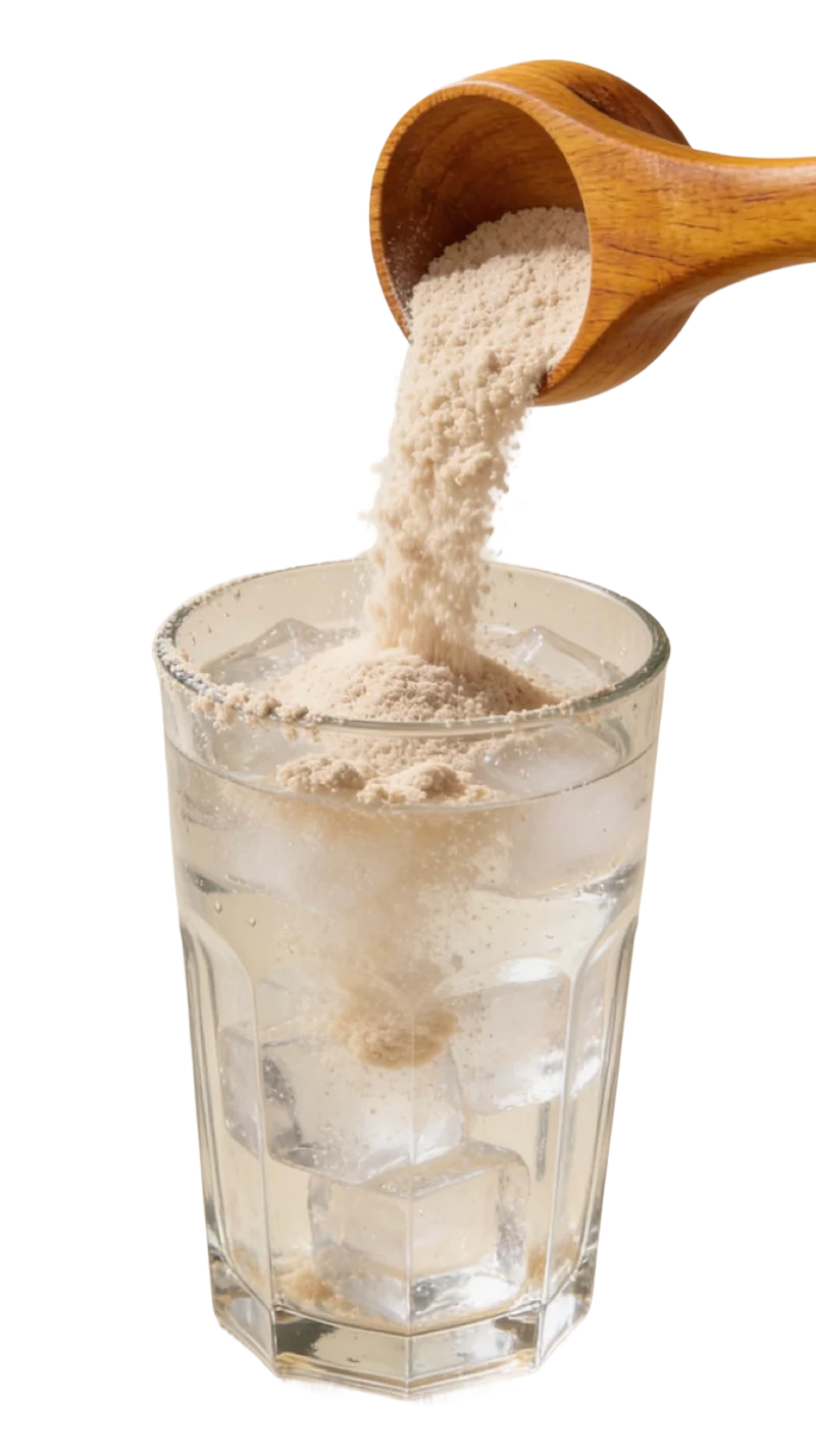 Clumpy collagen powder being scooped into a glass